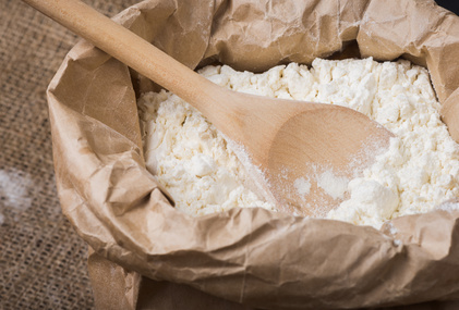 Whole flour and wooden spoon